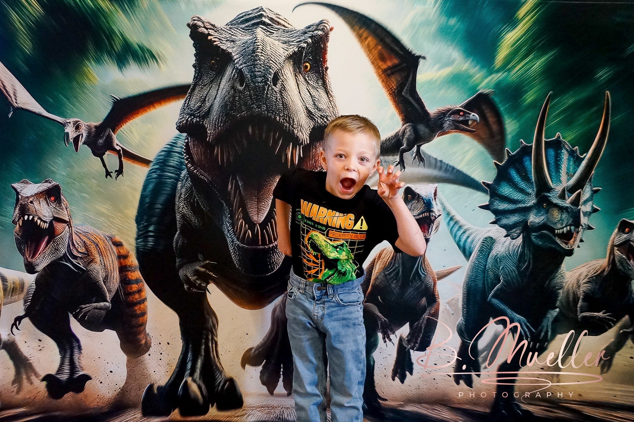 Funny boy standing in front of dinosaur backdrop