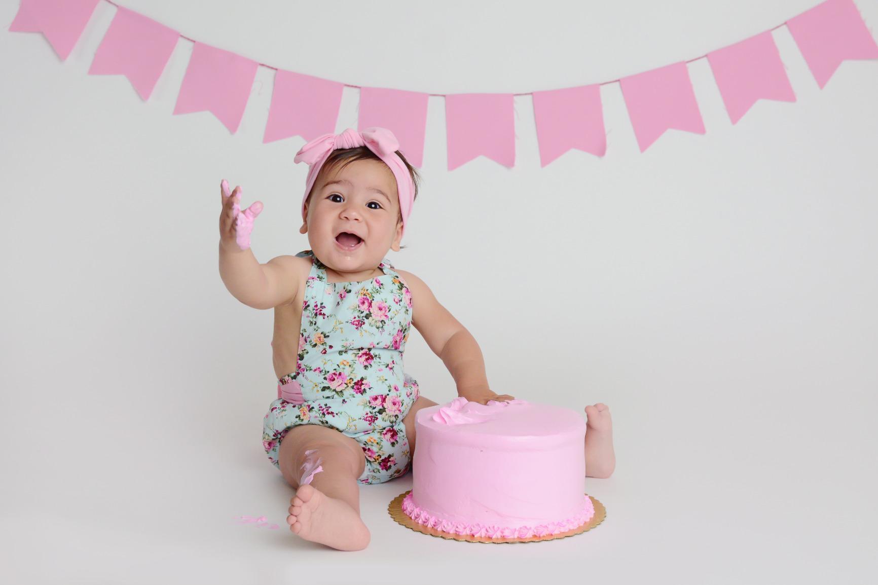Birthday boy with pink cake