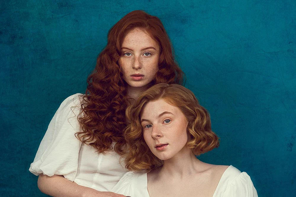 Girl in front of blue Collapsible backdrop