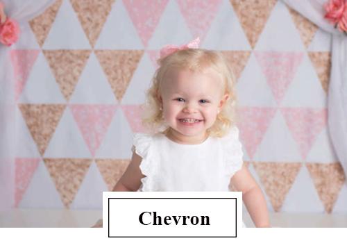 Smiling girl standing in front of triangle pattern backdrop