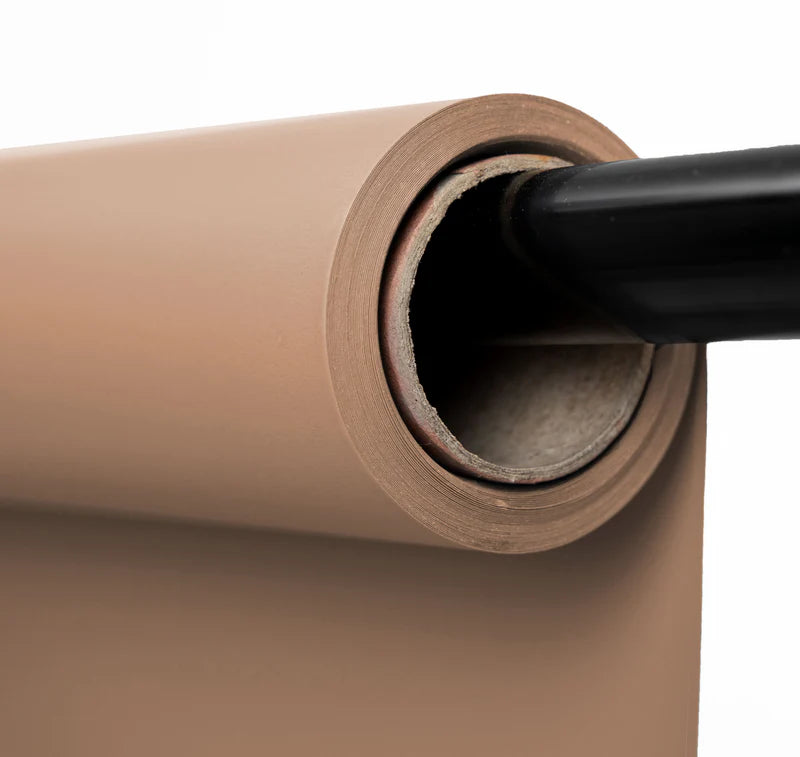 Roll of brown paper with a black handle on a white background