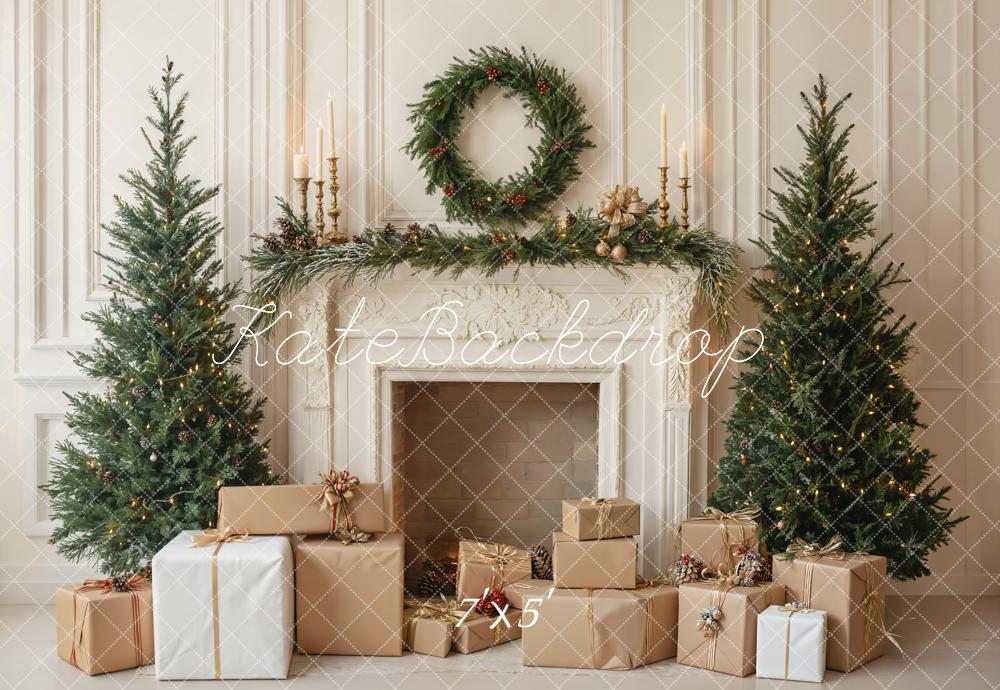 A Christmas-themed backdrop featuring a decorated fireplace with gifts wrapped in brown paper around the hearth, flanked by two Christmas trees, with a garland and candles above the fireplace.