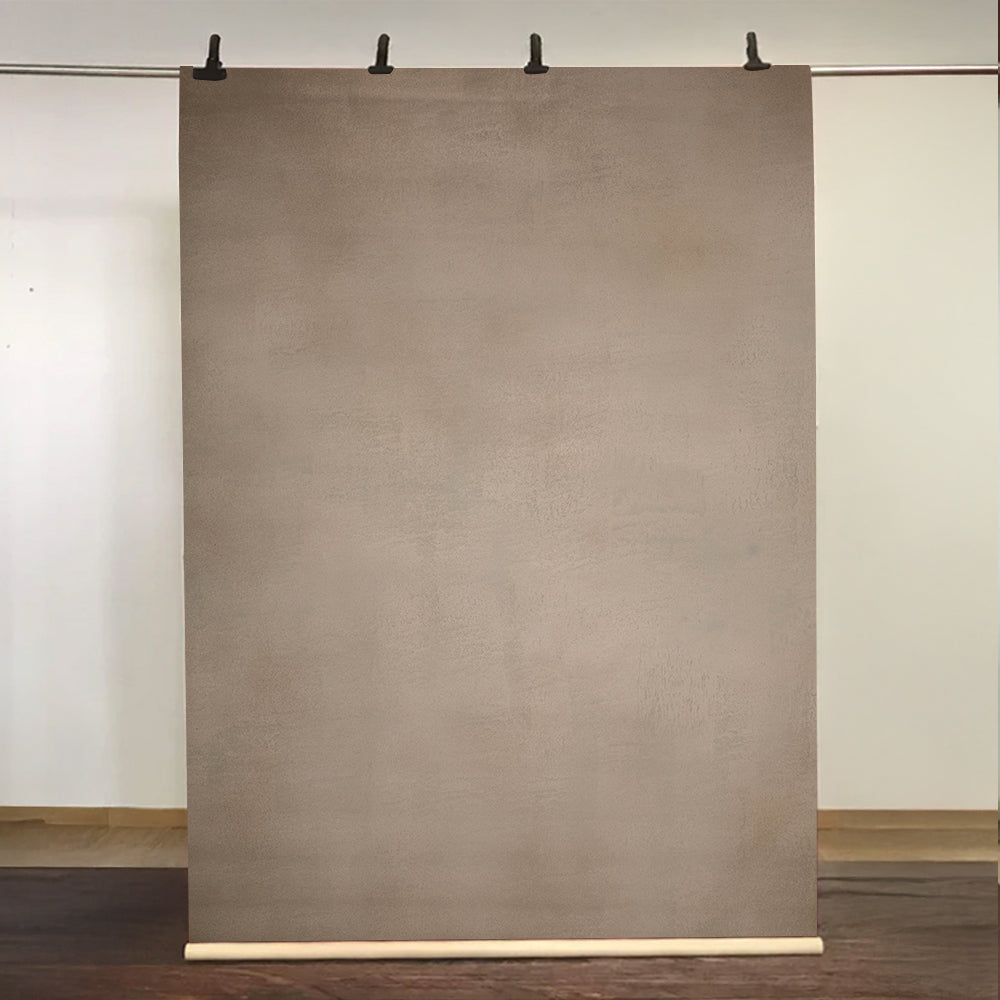 Brown paper sheet on a stand against a white wall