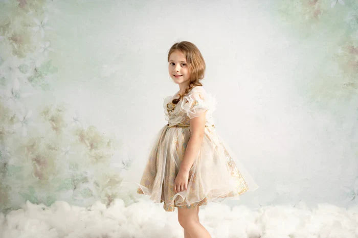 Girl standing in front of fine art backdrop