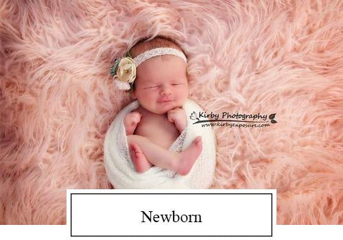 Baby sleeping on pink blanket