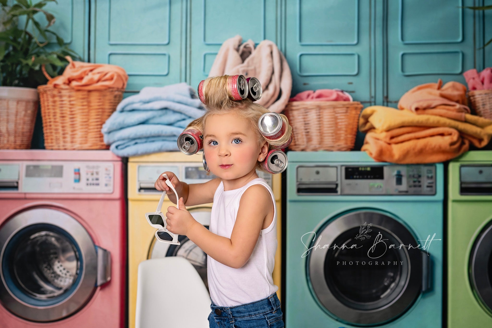 Girl with can hairstyle in front of washing machine backdrop