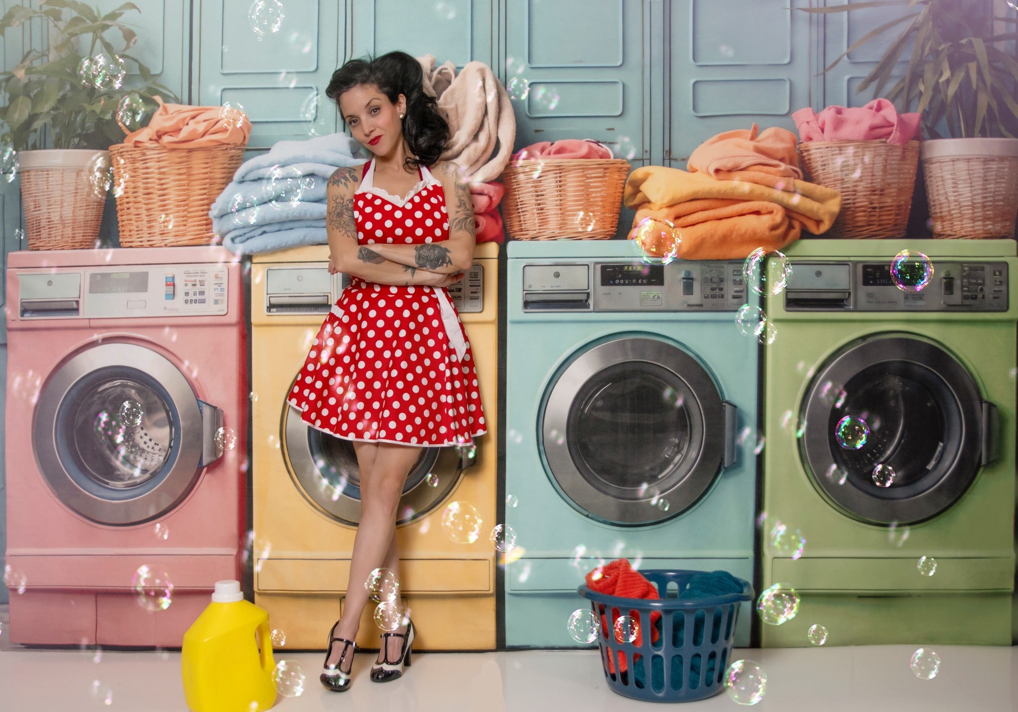 Girl standing in front of washing machine backdrop
