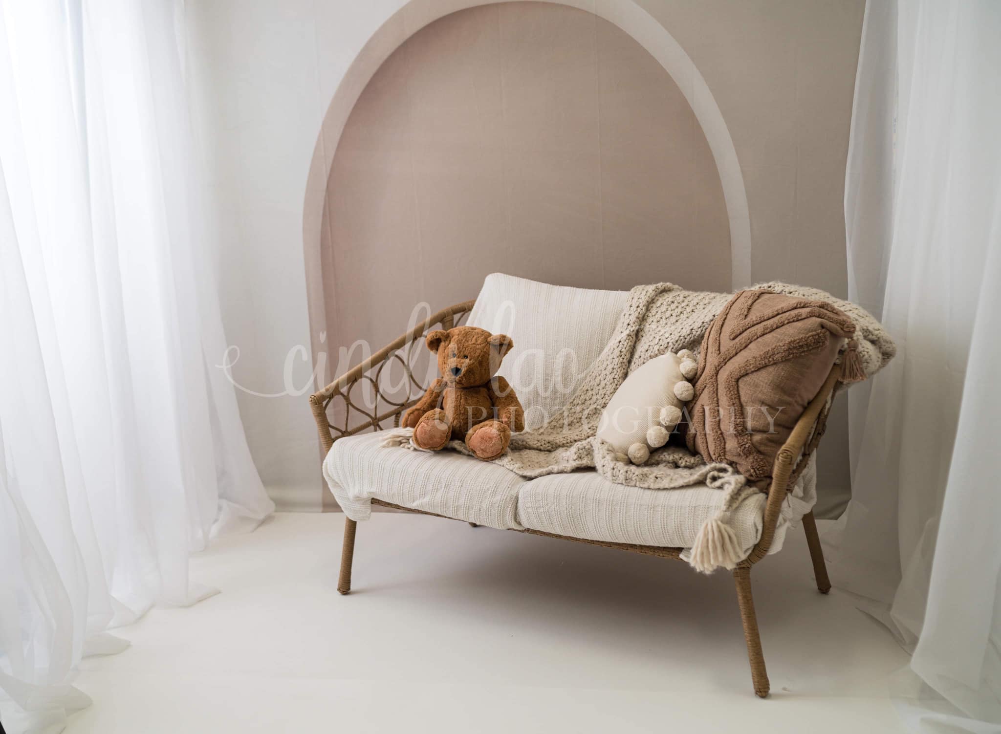 Sofa placed in front of boho backdrop