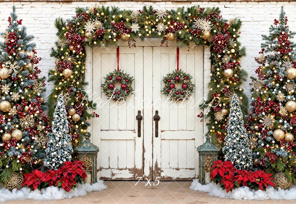 Decorative Christmas scene with a white door, wreaths, garlands, and trees.