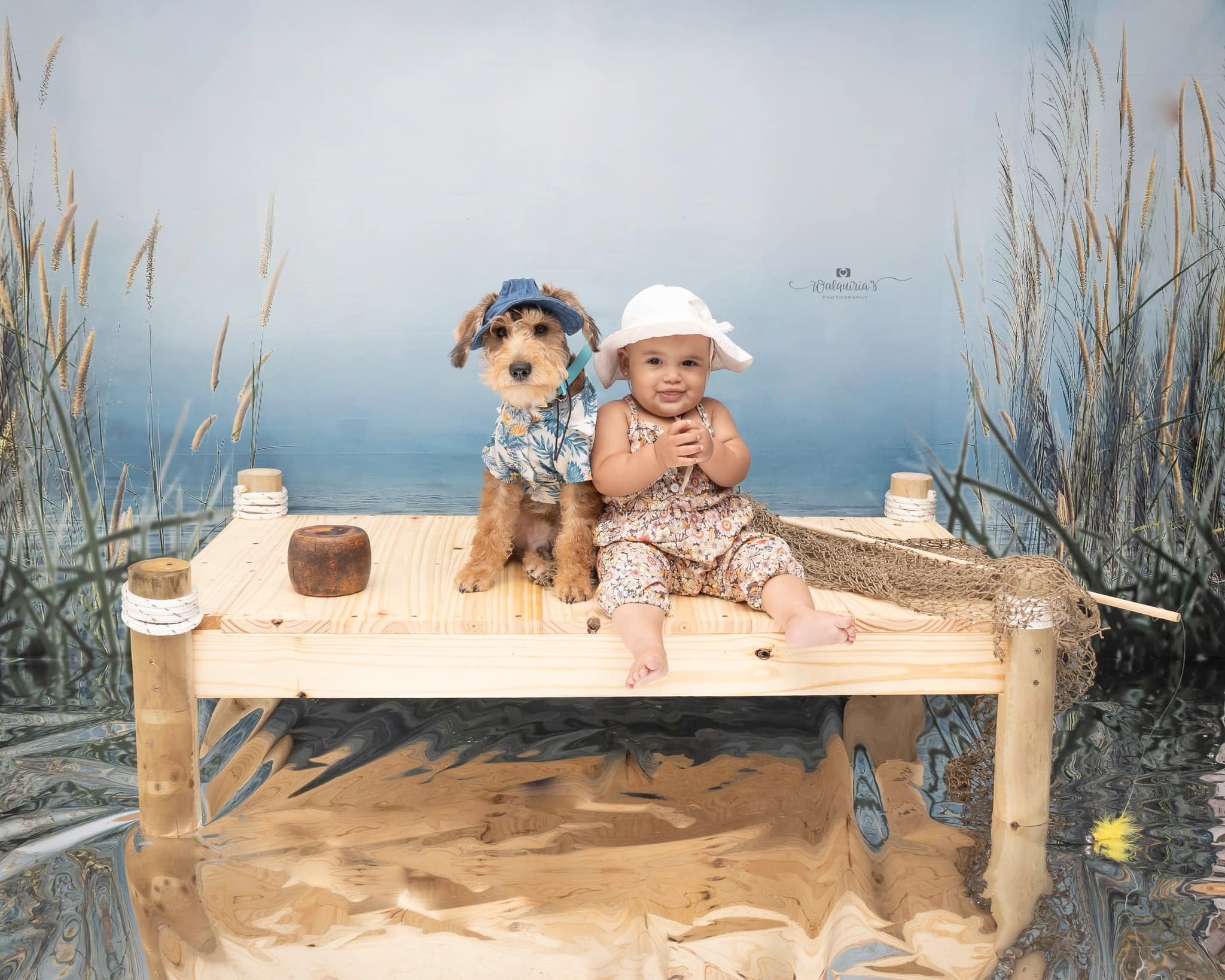 Dog and boy sit in front of Reed Cloudy Sky Lake Backdrop